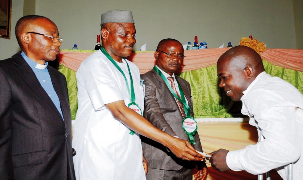 L-R: Provost, Federal College of Technology, Ehaoamafu, Prof. Benjamin Mbah, Managing Director, Peace Mass Transit Limited, Mr Sam Onyshi, Deputy Vice Chancellor, University of Nigeria, Nsukka (UNN), Prof Polycarp Chigbo and a beneficiary of a Scholarship Award, UNN Eletronics Engineering Student, Mr Asogwa Chukwuemeka, during Samuel Maduka Onyishi African Entrepreneurship Foundation Scholarship Award ceremony.