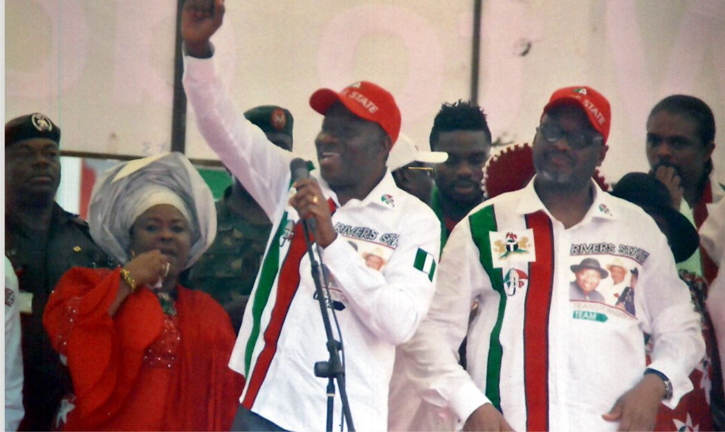 President Goodluck Jonathan (middle) addressing supporters at Adokiye Amiesimaka Stadium, Port Harcourt, during a campaign rally last Wednesday. He is flanked by PDP National Chairman, Adamu Mu’azu (right) and Dame Patience Jonathan (left). Photo: Chris Monyanaga
