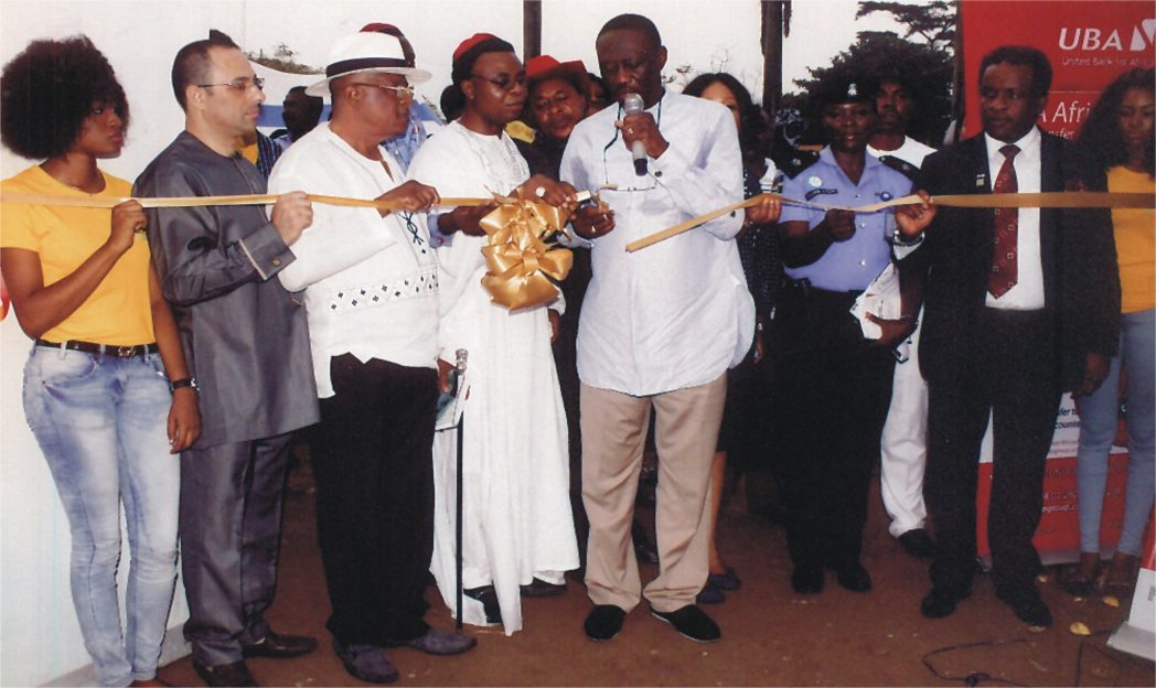 Former PHCCIMA President and FOSSCCIMA President, Prince Billy Gillis Harry, representing NACCIMA President, Alhaji Mohammed Baduru, (middle) cutting a tape for official opening of 2014 Trade Fair recently at Isaac Boro Park Port Harcourt. With him are President PHCCIMA, Engr. Emeka Unachukwu (right), former president PHCCIMA, Dr. Vincent Furo 2nd (left) and Chief Nabil Saleh (left). Photo: Egberi A. Sampson