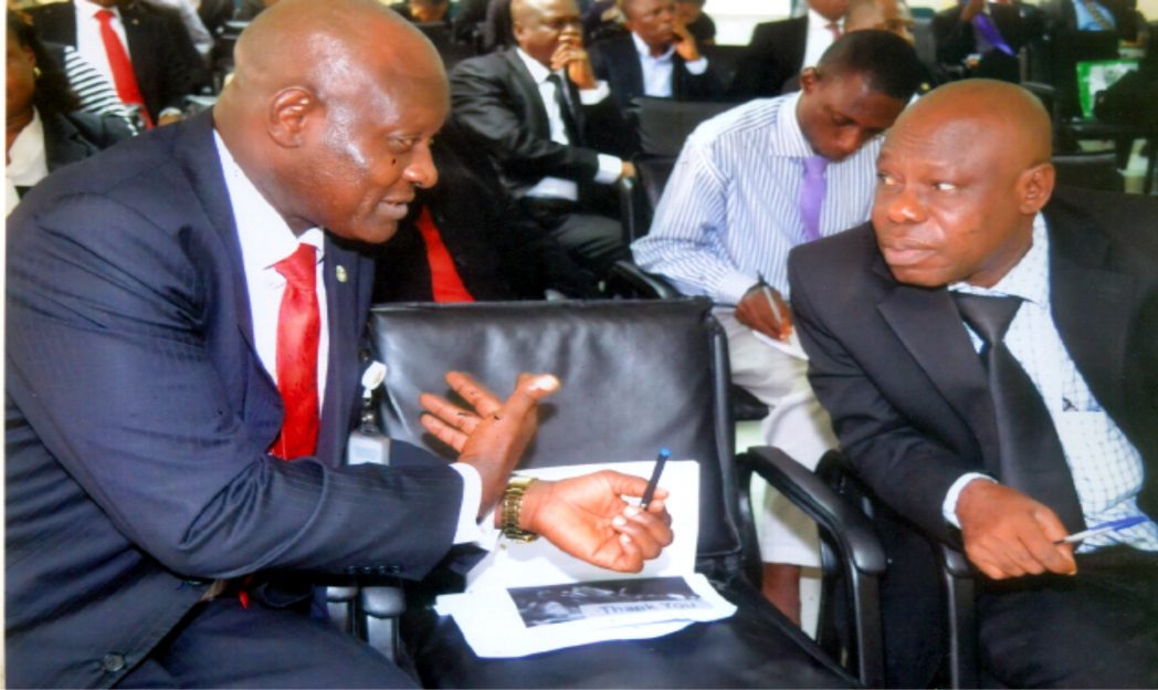 Assistant Director, Development Finance Department, CBN., Mr Babatunde O. Ogunlaja (left) discussing with Manager NAICOM, Port Harcourt, Mr Emma Ndukuha during a workshop on Financial Inclusion, CBN, Port Harcourt branch recently. Photo: Chris Monyanaga.