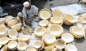 A calabash carver, Malam Usman Datti, at work at Maraban Liman Katagum Market in Bauchi Local government Area last Thursday