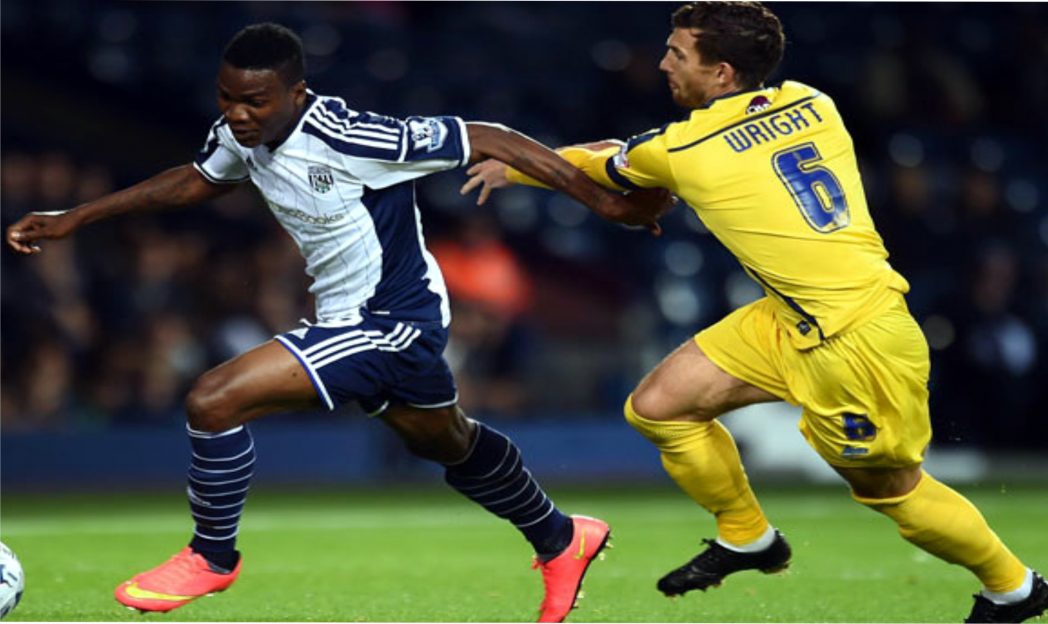 Brown Ideye (left) in West Brom’s colour trying to check off an opponent in an English Premier League game