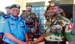 Commissioner of Police, Sokoto State, Alhaji Salisu Fage (left), in a handshake with the  Commander, Nigeria Army Brigade, Sokoto, Brig.-Gen.Chikezie Ude, during the general's visit to state police command headquarters in Sokoto, recently. Photo: NAN