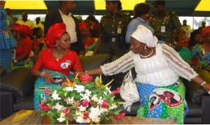 Wife of APC governorship candidate in Rivers State, Barr. (Mrs) Elima Peterside, discussing with Mrs. Judith Amaechi, wife of Executive Governor of Rivers State, during a town hall meeting with women at Emohua LGA
