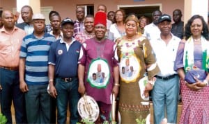 Apga Senatorial Candidate for Anambra Central, Chief Victor Umeh (middle); his wife, Prisca (4th-right); Chairman, National Union of Local Government Employees (Nulge), Mr Jerry Nnubia (3rd-left); Nulge Secretary, Austin Okoro and other officials after a meeting where the union endorsed his candidature in Awka recently.
