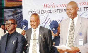 L-R: Assistant Director, Public Affairs, Nigeria  Deposit Insurance Corporation (NDIC), Mr Hakeem Bakare, President, Enugu State Chamber of Commerce, Industry, Mines and Agriculture ( ECCIMA), Dr Ifeanyi Okoyi and representative of Managing Director, NDIC, Mr Frank Akinola, during NDIC Special Day at the ongoing ECCIMA International Trade Fair in Enugu, yesterday.