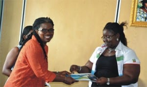 Commissioner for Information and Communications, Mrs Ibim Semenitari (right) presenting Hon Dakuku Peterside’s Roadmap tp prosperity document to chairman, National; Association of Women Journalists (NAWOJ), Rivers State, Mrs Lilian Okonkwo, during a courtesy visit to the commissioner’s office in Port Harcourt, yesterday
