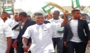 Imo State students jubilating after receiving 750 laptops from the state government in Owerri, recently.        Photo: NAN