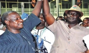 Out-going NLC President, Comrade Abdulwahed Omar (left), presenting Comrade Ayuba Wabba as the newly elected President of the congress, tt the 11th NLC Delegates Conference in Abuja, recently. 