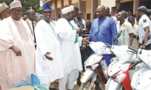 The District Head of Gabasawa, Alhaji Jibrin Mohammed, presenting  keys of a motorcycle to one of the beneficiaries of Umar Sani Foundation’s 2nd Youth Empowerment Programme in Kaduna, yesterday. With them are Governor Ramalan Yero of Kaduna State (2nd left) and the sponsor and Senior Special Assistant to the Vice President on Media and Publicity, Umar Sani.