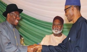 Nigerian President Goodluck Jonathan (lleft), Chairman of the Abuja Peace Accord, General Abdulsalami Abubakar (middle) and All Progressives Congress candidate, Mohammadu Buhari sign pledges for peaceful elections yesterday in Abuja