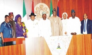 President Goodluck Jonathan (middle) with new  Ministers after their oath of office  during the Federal Executive Council Meeting in Abuja recently.