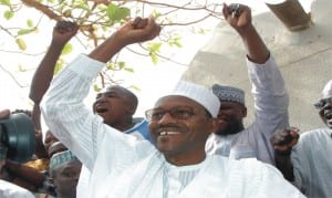 President-elect, Muhammadu Buhari acknowledging cheers from supporters after his victory at the presidential poll, yesterday.