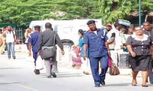 Civil servants resuming duty after Easter holidays at the Federal Secretariat in  Abuja, yesterday.