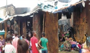 Scene of a fire incident which affected some locked up shops at Balogun Market in Lagos, recently. Photo: NAN