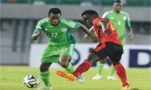 Nigeria’s Ogenyi Onazi (17) in contest with a Ugandan opponent, during their recent friendly in Uyo, Akwa Ibom State