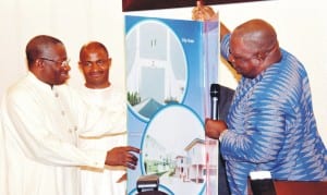 President Goodluck Jonathan (left), receiving Easter greeting card from sgf, Senator Anyim Pius Anyim (right),  during Easter homage to the President in Abuja last Sunday. With them is the Executive Secretary, Nigerian Christian Pilgrims  Commission, Mr john Kennedy Opara.  Photo: NAN