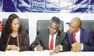 From Left: Group Chief Executive Officer, United Capital Plc, Mrs Toyin Sanni, Group Managing Director, United Bank for Africa Plc, Mr Phillips Oduoza and Managing Director, Financial Market Dealers and Quotation  (Fmdq), Mr  Bola Onadele, during the signing of Fmdq Bond Listing ceremony in  Lagos on Wednesday