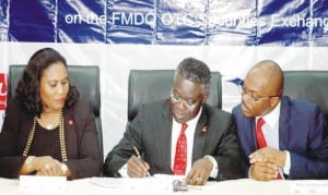 From Left: Group Chief Executive Officer, United Capital Plc, Mrs Toyin Sanni, Group Managing Director, United Bank for Africa Plc, Mr Phillips Oduoza and Managing Director, Financial Market Dealers and Quotation (Fmdq), Mr Bola Onadele, during the signing of Fmdq Bond Listing ceremony in Lagos on Wednesday