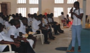 Omoku campaign cordinator for United State Agency for International Development (USAID), Miss Esther Adah, addressing Omoku youths during a peace building/Non Violence rally at Omoku Civic centre, recently