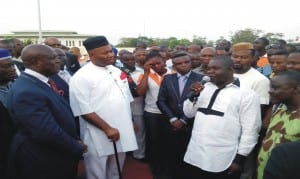 L-R: Akwa Ibom Commissioner for Transport, Mr Godwin Ntukedeh; Governor Godswill Akpabio of Akwa Ibom State and President of Akwa Progressive Commercial Taxi Tricycle and Motorcycles Association, Comrade Udo Johnson during the donation of 70  new Nissan buses to tricycle operators in Akwa Ibom last Friday.   Photo: NAN