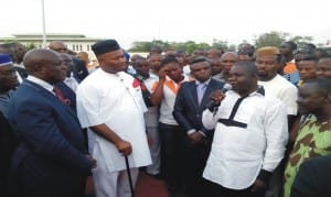 L-R: Akwa Ibom Commissioner for Transport, Mr Godwin Ntukedeh; Governor Godswill Akpabio of Akwa Ibom State and President of Akwa Progressive Commercial Taxi Tricycle and Motorcycles Association, Comrade Udo Johnson during the donation of 70 new Nissan buses to tricycle operators in Akwa Ibom last Friday. Photo: NAN