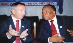 Deputy Managing Director, Total E &P Nigeria Limited, Mr Nicolas Brunel (left) discussing with Dr Emmaunel Onu Egbogah during the Institute of Petroleum Studies of UNIPORT 10th Induction/Anniversary ceremony, recently.               				Photo: Obina Prince Dele