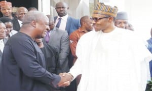 Ghanaian President John Mahama (left) being received by the President-elect,  Maj.-Gen.  Muhammadu Buhari during his visit in Abuja, recently