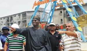 L-R: Lagos Commissioner for Establishment and Training, Mrs Florence Oguntuase, Gov. Babatunde Fashola of Lagos State, Commissioner for Tourism, Mr Disun Holloway And Managing Director, Crystal Cubes Ltd., Ibrahim Haydar, during the Governor's visit to Apapa Amusement Park Project in Lagos recently.