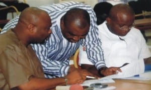 Leader of the House, Hon Chidi Lloyd (left) conferring with chairmen House Committee on Judicary, Hon Golden Chioma (middle) House Committee on Finance, Hon Josiah Olu (right) during the sitting of the house, recently. Photo: Chris Monyanaga