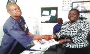 The Rivers State Director, National Orientation Agency (NOA) receiving information, education and communication materials from the Chairman, OBSTEC, Barrister Florence Fiberesima during advocacy meeting held  in Port Harcourt, yesterday. Photo: Sogbeba Dokubo