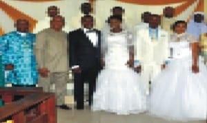 L-R: Deputy Registrar/PRO, Rivers State University of Science and Technology, Chief Des I. Wosu, Vice Chancellor of the institution, Prof. B. B. Fakae and others in a group photograph with Mr and Mrs Ezemonye Joseph Des-Wosu shortly, after their marriage solemnization at Our Lady Seat of Wisdom Catholic Chaplaincy, RSUST, Port Harcourt, recently.