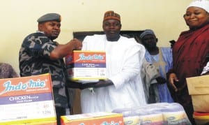 Commander of the 79 Composite Group, Nigerian Air Force, Maiduguri, Air Commodore Christopher Egwoba (left), presenting relief materials to Mallam Haji Ngamdu, Secretary, Borno State Ministry of Women Affairs and Social Development, for distribution to Fatima Sheriff Motherless Babies Home, as part of activities to mark the NAFS 51st anniversary in Maiduguri, recently