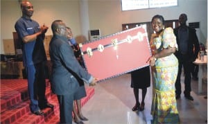 Chairman of the occasion/Chairman Civil Service Commission, Rivers State, Sir Ngo Martins-Yellowe (left) presenting a gift on behalf of Ministry of Information and Communications to the Commissioner, Mrs Ibim Semenitari, during her send-forth ceremony organised by the ministry in Port Harcourt, Monday. With them is the Perm Sec of the ministry, Sam Woka (left)