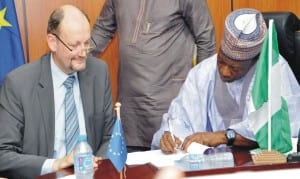 Minister of National Planning, Dr Abubakar Sulaiman (right), signing financial agreement for the 11th European Development Fund Support to strengthen community-based psychosocial and protection services for children and adolescents in Borno State, in Abuja recently. With him is the Head, European Delegation, Mr Michel Arrion.