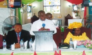 Bishop, Dioceses of Okrika, Rt Rev Tuboko Semie R. Abere (middle), making an opening address during the church of Nigeria Anglican Communion, Diocese of Okrika, 3rd Session of the 4th Synod at St Mary’s Anglican Church, Kalio Ama. With him are Mrs Zipporah T. Abere (right) and Chancellor, Diocese of Okrika, His Lordship Justice Sika Henry Aprioku, (KSC.Photo: Egberi A Sampson