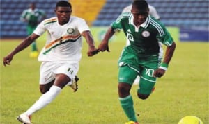 Flying Eagles Striker, Kelechi Iheancho in hot pursuit by an opponent during recent match for Nigeria