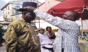 Director of Social Welfare, Ministry of Social Welfare and Rehabiltation Mr. Iminabo Fubara (right) decorating the outgoing Commissioner for Social Welfare and Rehabilitation . Hon Joe Poroma (left) during the sendforth party by ministry staff.                           Photo: Chris Monyanaga