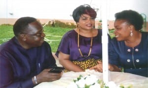 Commissioner for Social Welfare and Rehabilitation, Hon Joe Poroma (left), conferring with his Permanent Secretary, Ms Kadilo Brown (right) and his wife, Rita, during his sendforth in Port Harcourt, Tuesday