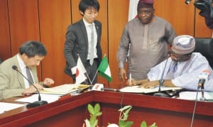 Minister of National Planning, Dr Abubakar Sulaiman (right), and representative of Japanese Ambassador to Nigeria, Mr Masaya Otsuka (left), signing exchange notes for provision of Japanese disaster reduction equipment. in Abuja, recently. Photo: NAN