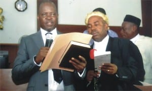 The new Speaker of the Rivers State House of Assembly, Rt Hon Ikuinyi-Owaji Ibani (left), taking his oath of office, at the Assembly complex in Port Harcourt on Monday