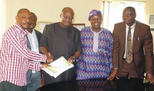 Secretary, Nuj, Fct, Mr Emmanuel Ogbeche (left), presenting a nomination form for the post of the Nuj President to the National Secretary of the union, Mr Shu'Aibu Leman, on behalf of Mustapha Lamidi of the News Agency of Nigeria (Nan), during the submission of the form for Nuj Election in Abuja recently. With them are the contestant, Mr Mustapha Lamidi (2nd-right) and Chairman, Nan Chapel, Mr Felix Ajide.
