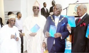 L-R: Founder, Chartered Institute of Bankers of Nigeria, (CIBN), Alhaji Oladimeji Otiti, Oba of Lagos, Obarilwan Akiolu, President, CIBN, Dr Sina Aina and Chairman, First City Monument Bank, Otunba Micheal Balogun, during the unveiling of a book titled “The Economy of Financial Inclusion In Nigeria” written by Dr Aina in Lagos.