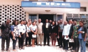 Lecturer, Dept of English and Communication Studies, Federal University, Otuoke, Bayelsa State, Dr. Desmond Osueke (middle), with Mr. Musah Oyekemeagbegha (6th left) in a group photograph with the students of the Department, during their excusssion visit to the Rivers State Newspaper Corporation Port Harcourt, yesterday