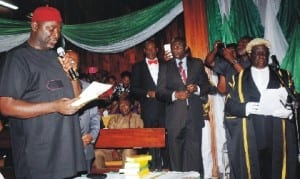 Newly elected Speaker of Enugu State House of Assembly, Chief Edward Ubosi (left), taking oath of office before the Clerk of the House, Sir Amadi Chukwurah (righ), at the inauguration of the 6th Enugu State House of Assembly in Enugu, last Monday