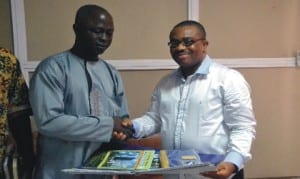 General Manager, Rivers State Newspaper Corporation, Mr Celestine Ogolo (left) receiving calendars from the chairman, Nigeria Institute of Quantity Surveyors, Mr Anifowose Abayomi (MNIQs) during the visitation of the association to the corporation, recently.Photo: Nwiueh Donatus Ken