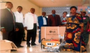 Rivers State Publicity Secretary, National Clergy Forum, Pastor Emma Ikono (left), State Secretary, NCF, Pastor Hope Eme (2nd left), representative of the State Governor, Hon. Prince Obi Wali (4th left), National President, NCF, Bishop (Dr) Hyginus Ndukaife (5th left), representative of Women Dignitary Initiative, Ms Patience Okoji (3rd right) and a beneficiary of NCF’s empowerment scheme, Mrs Blessing Emmanuel at the presentation of empowerment equipment in Igwuruta near Port Harcourt, last Saturday.