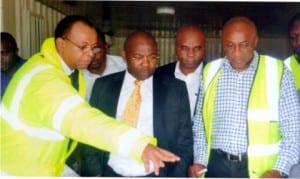 Sole Administrator, Greater Port Harcourt City Development Authority, Ambassador Desmond Akawor (2nd left), briefed by the Secretary of GPHCDA’s board, Mr John Singer, during an inspection visit to projects in Port Harcourt recently    Photo: Ibioye Diama