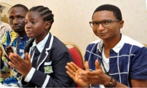 L-R: President, Youth Initiative for Sustainable Human Development in Africa, Mr Joseph Yaba, President, World Bank Children Forum, Miss Peace Chiejine and Chief Executive Officer, Connected Development, Mr Hamzat Lawal, at the day of the African Child celebration in Abuja last Tuesday.                                                            Photo: NAN