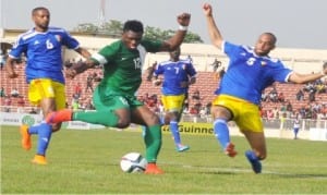Super Eagles player (12) trying to shoot past a Chadian defender in a 2017 AFCON Qualifier played in Kaduna, two weeks ago